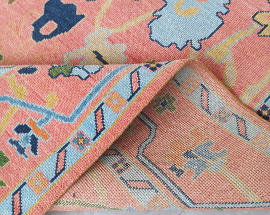 Folded corner of handwoven wool rug showing thickness and craftsmanship