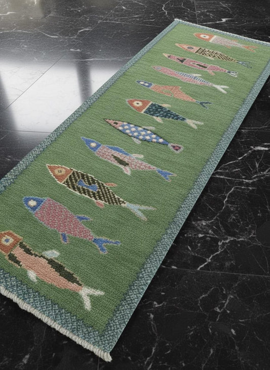 Decorative rug with fish pattern on a dark surface