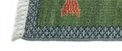 Detailed border craftsmanship on handmade Oushakaura wool fish runner rug