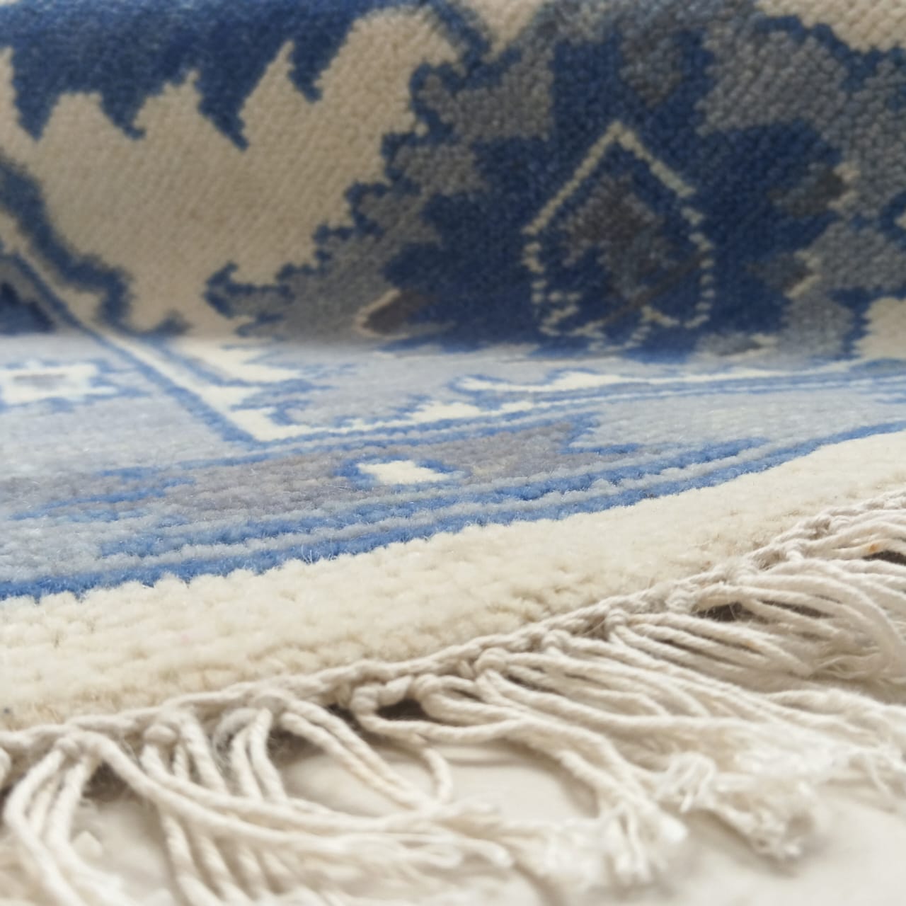 Hand-finished fringe edge on artisan wool rug
