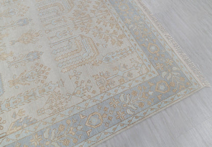 Blue beige traditional runner rug showing floral border and woven texture