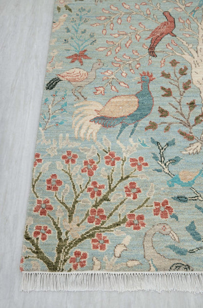 Blue botanical runner rug with colorful birds, flowering branches and floral motifs