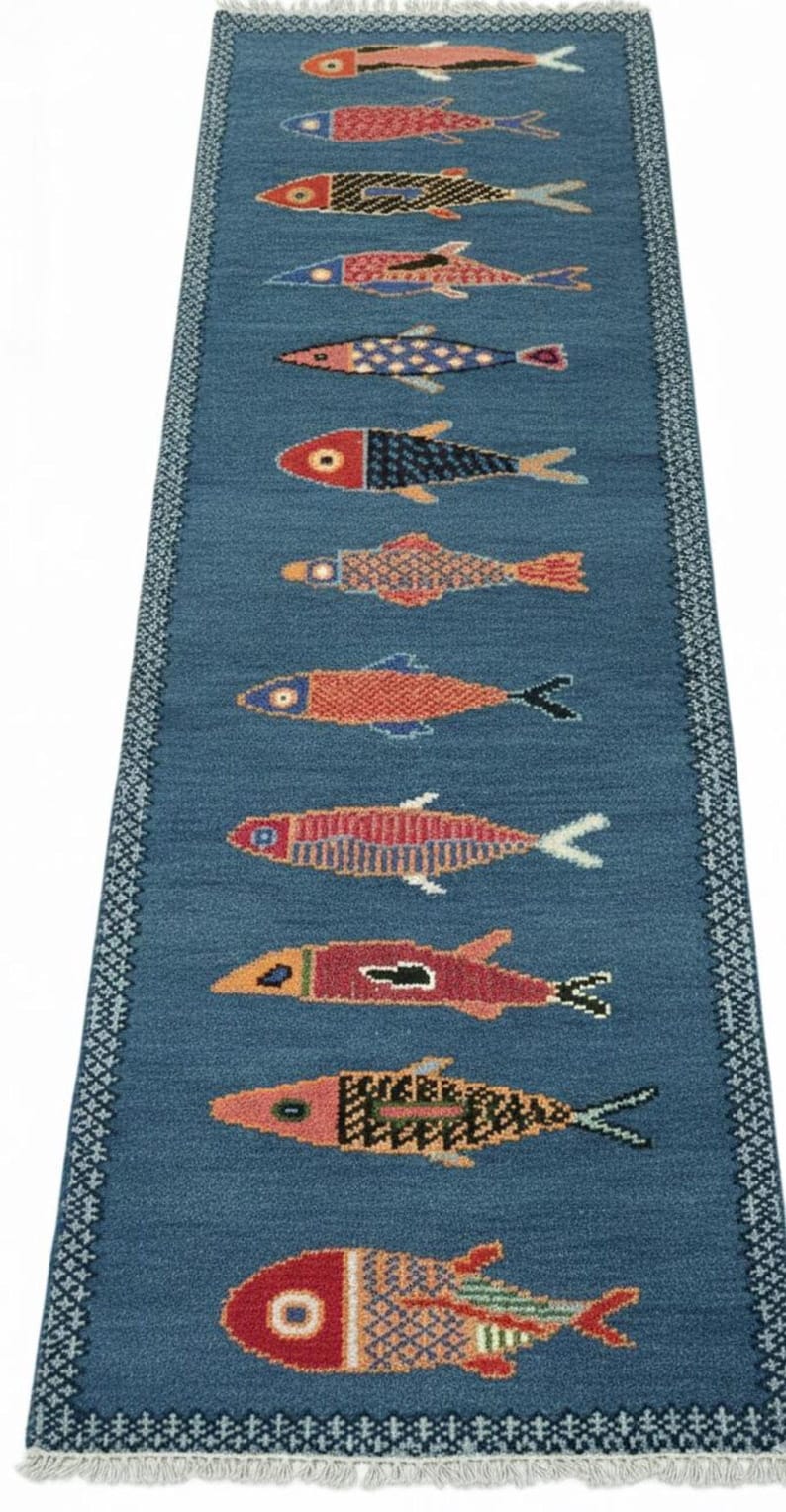 Full view of handmade blue fish hallway runner rug with colorful fish design