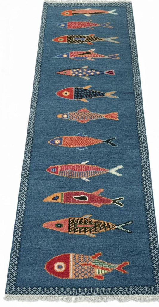 Full view of handmade blue fish hallway runner rug with colorful fish design