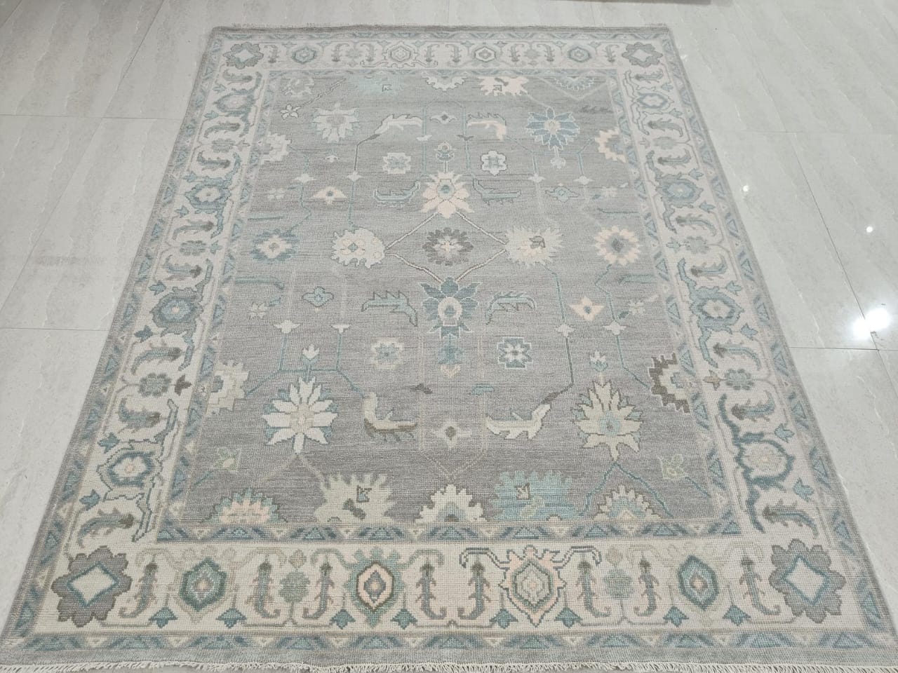 Blue grey Oushak hand tufted floral area rug full top view with ivory border