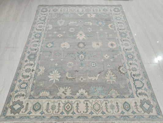 Blue grey Oushak hand tufted floral area rug full top view with ivory border