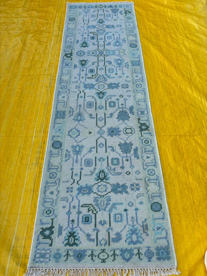 Handmade blue Oushak runner rug showcasing full length and detailed design
