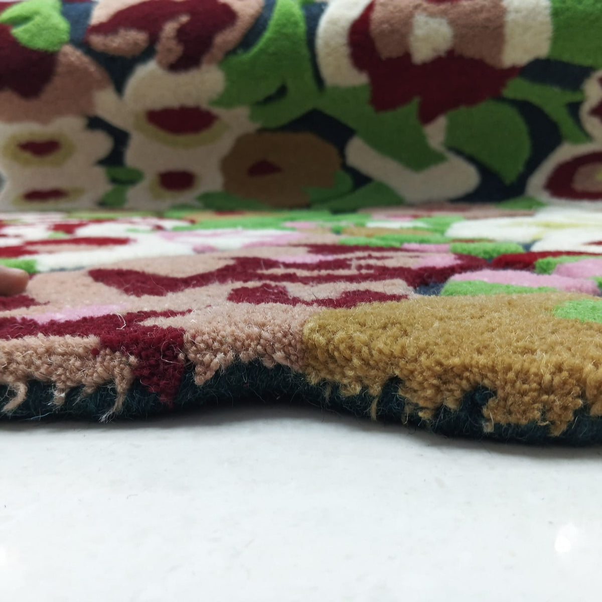 Detailed raised floral texture on a colorful botanical area rug