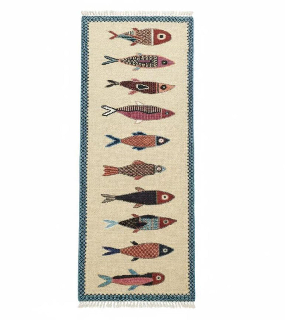 A rectangular woven runner rug with a cream background, featuring a vertical row of stylized fish in red, pink, blue, black, and orange, framed by a blue patterned border and white fringe on the ends.