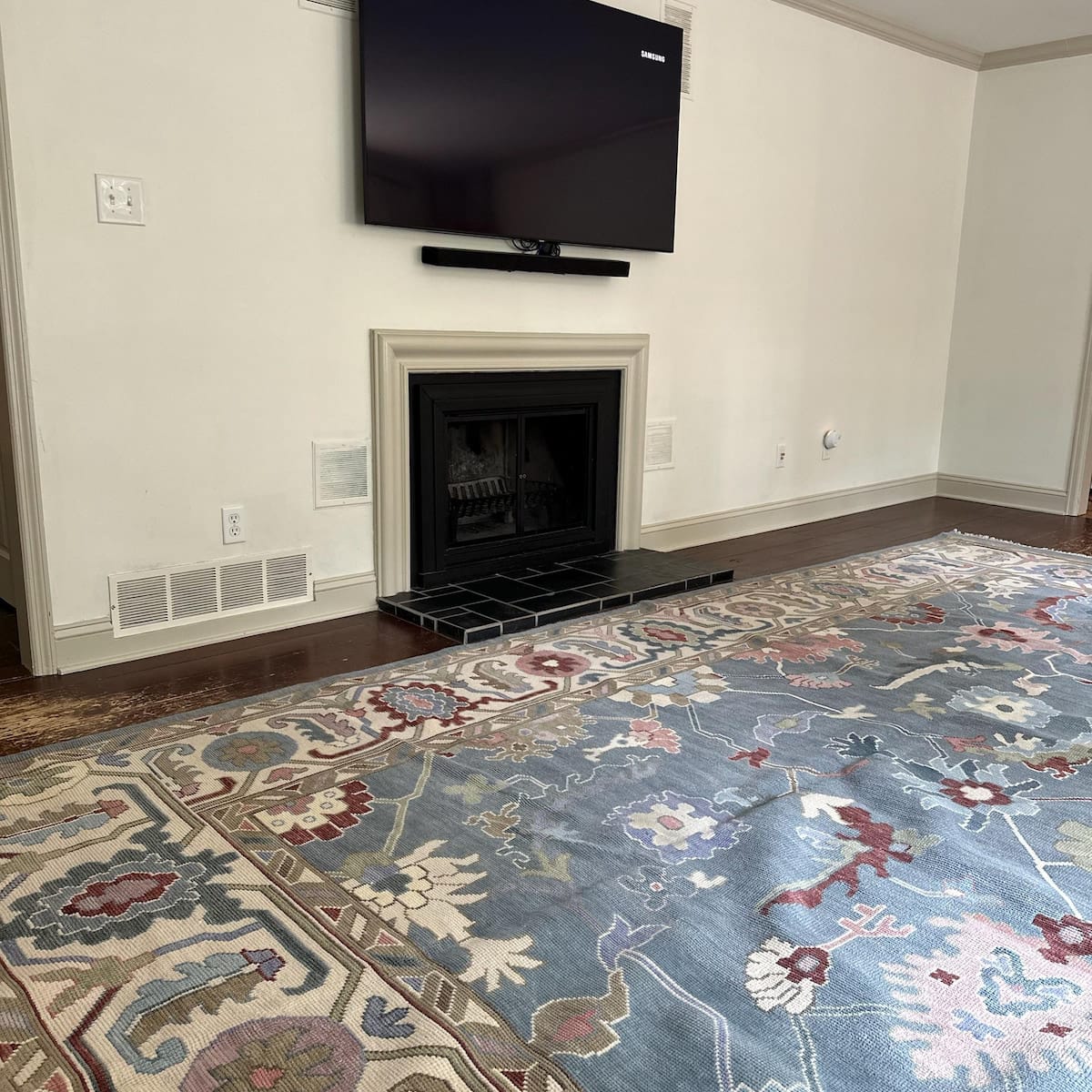 Featured hand-knotted Oushak rug styled in a luxury living room interior with soft blue and beige tones”