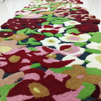 Side profile showing raised pile height of a floral area rug