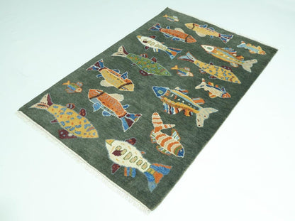 Children's rug with colorful fish pattern on a green background