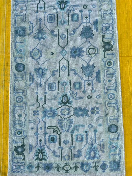 Hand-knotted blue Oushak runner rug with geometric pattern made from wool