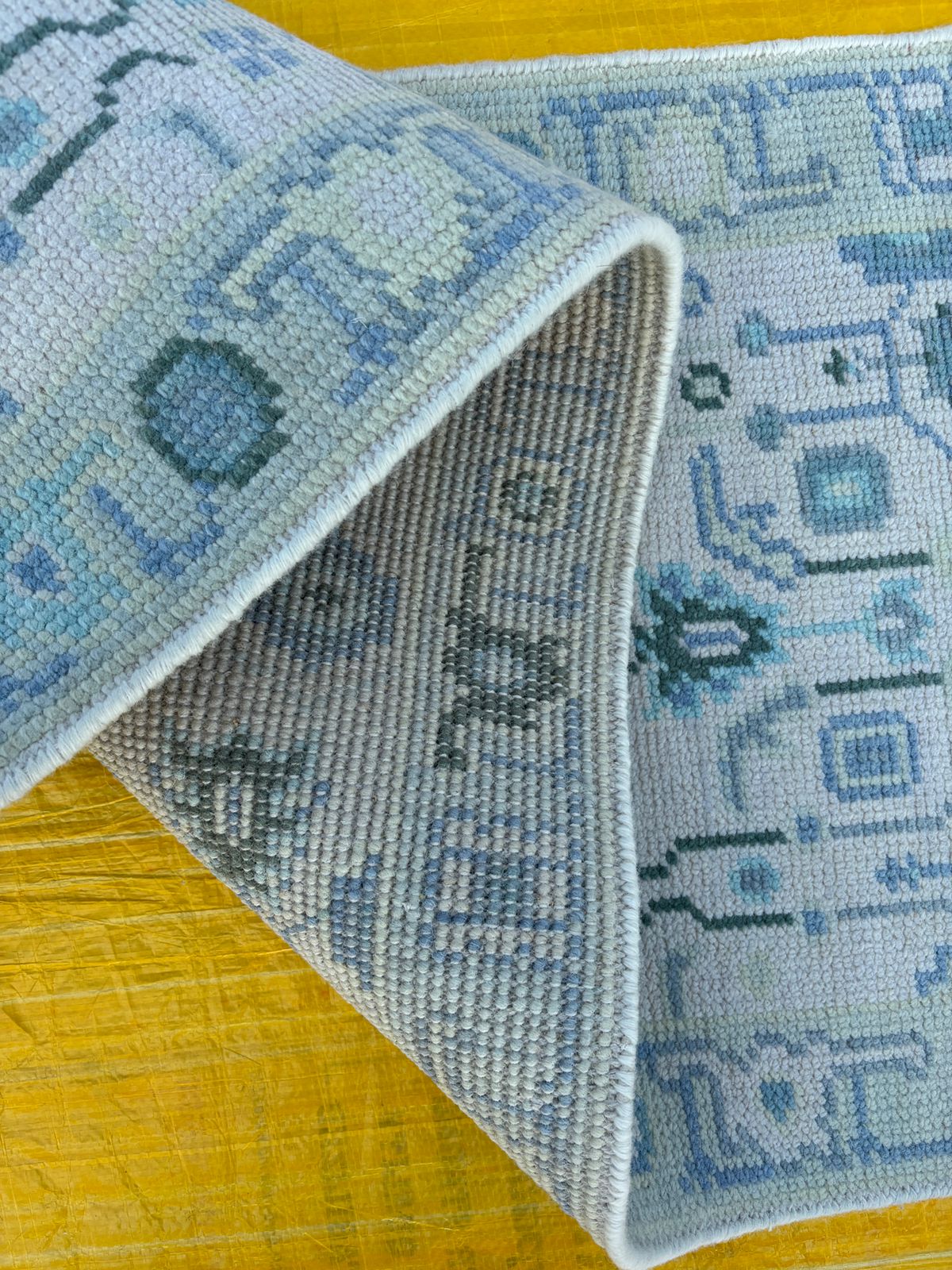 Back view of hand-knotted Oushak runner rug showing fine wool craftsmanship