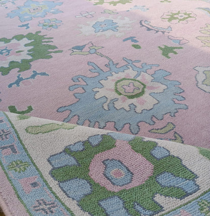 Pink Oushak Rug with Blue & Green Floral Design
