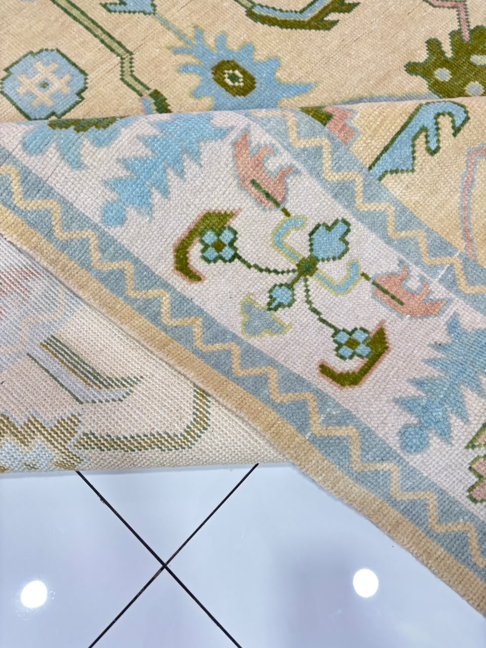 Handmade ivory and sky blue Oushak wool area rug with traditional floral vintage Turkish design for living room.