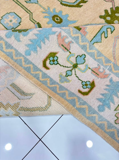 Handmade ivory and sky blue Oushak wool area rug with traditional floral vintage Turkish design for living room.