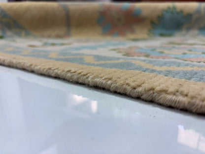 Low pile thickness detail of handmade wool Oushak rug.