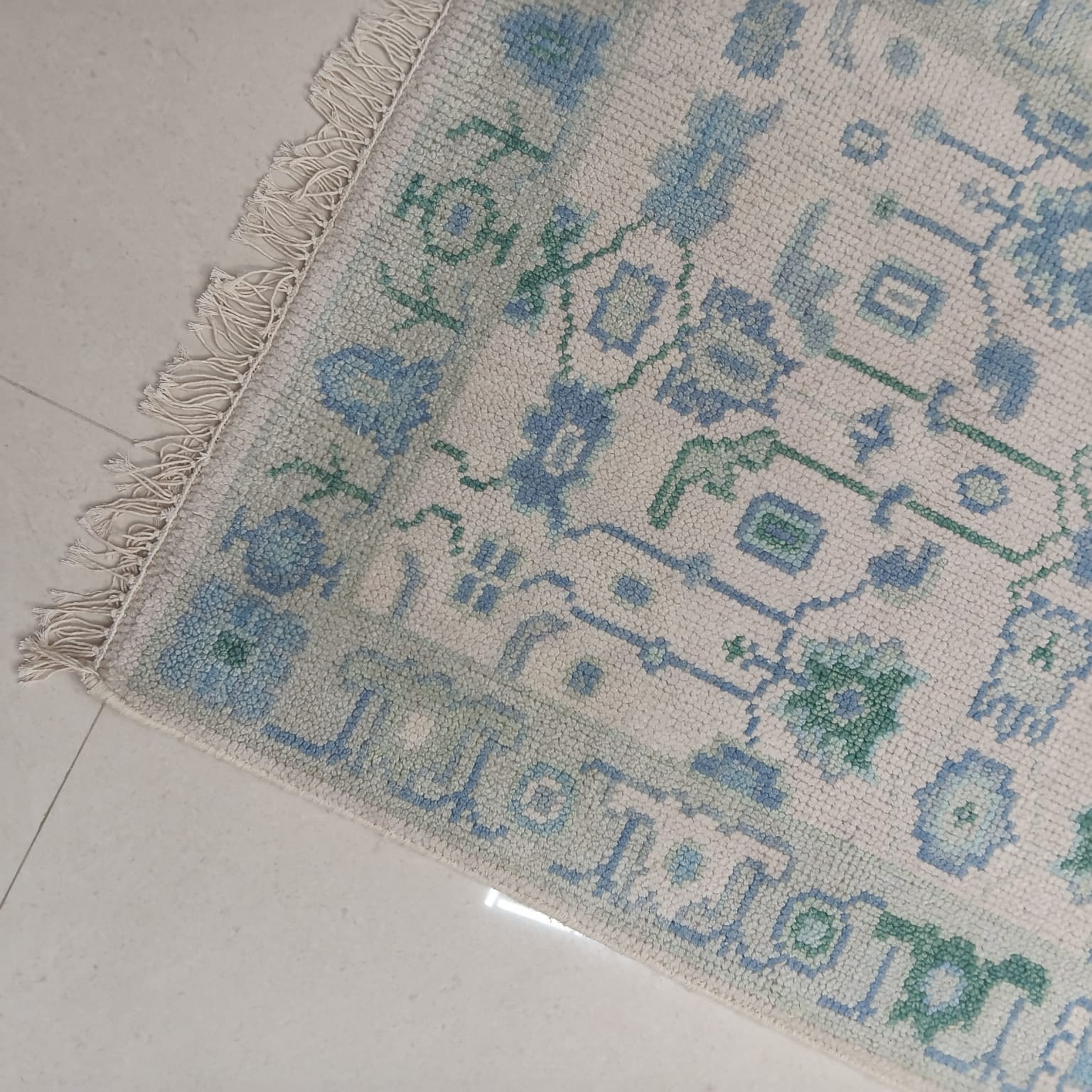 Handmade wool runner rug with natural fringe detailing