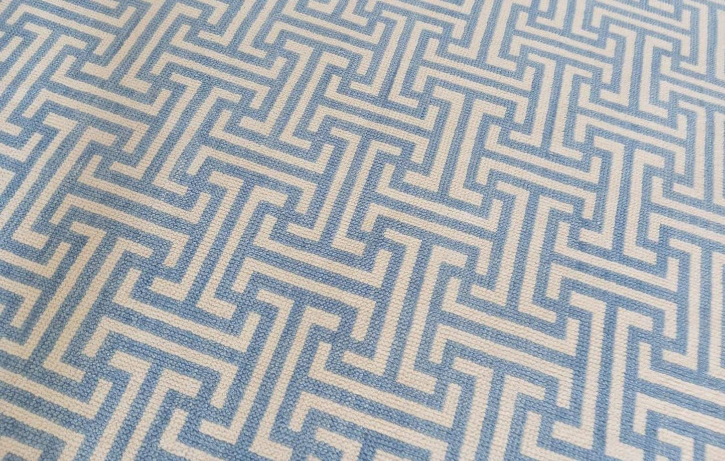 Handwoven blue and ivory geometric wool rug pattern detail