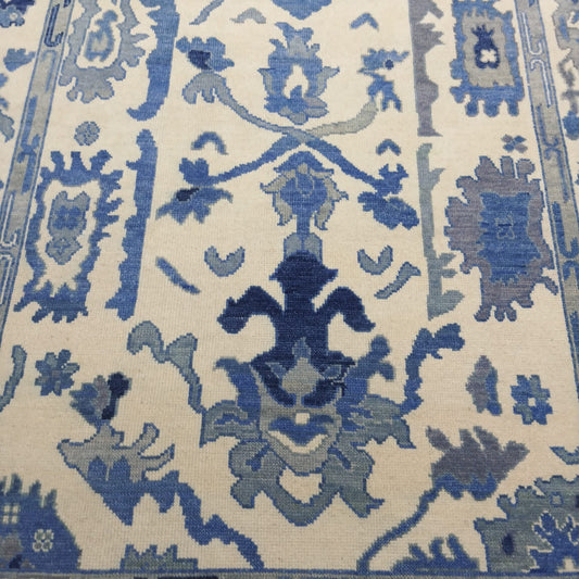 Handwoven blue and ivory Oushak wool rug full view
