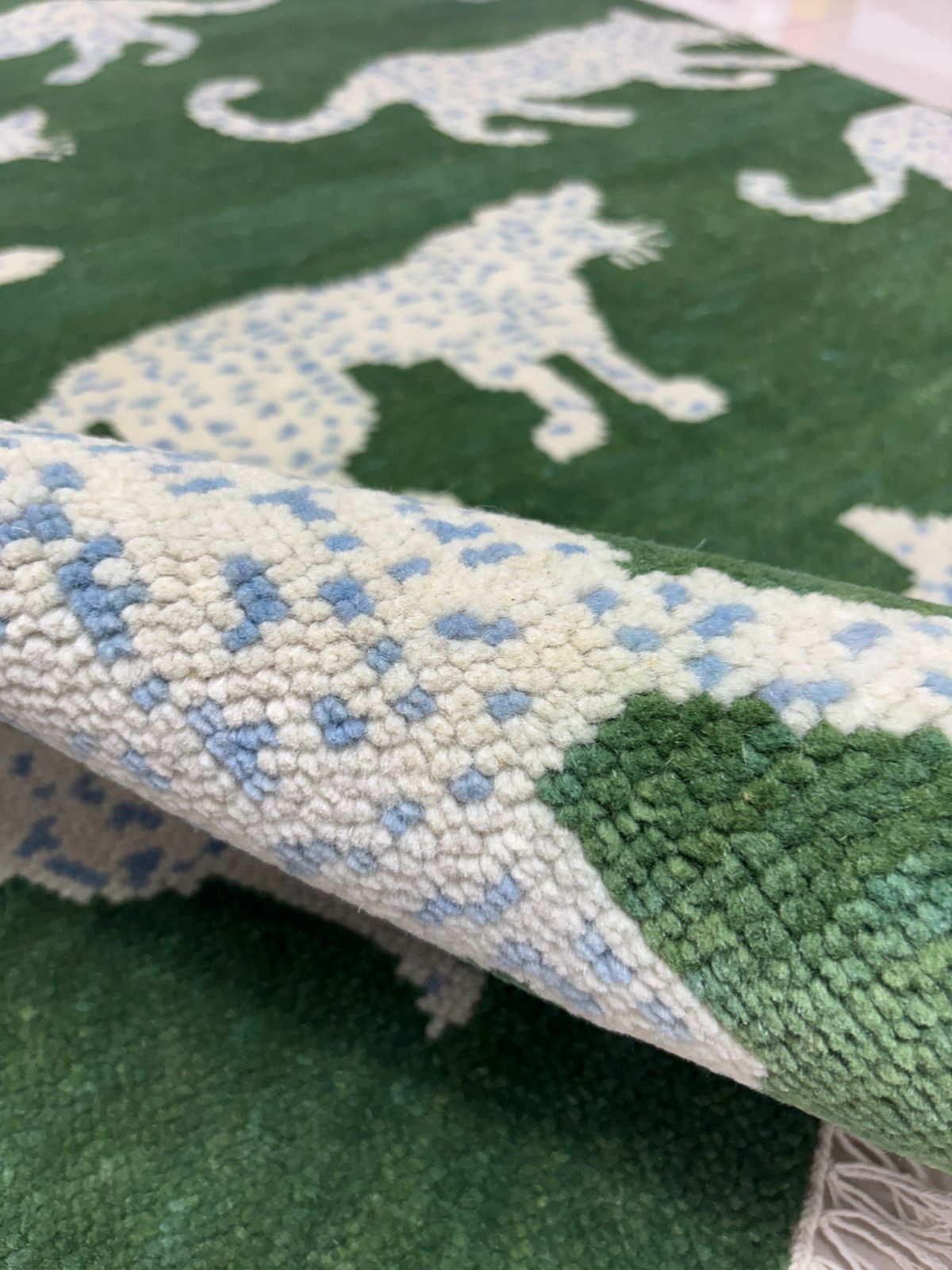 Close-up of the knotted artisanal texture of handwoven wool  rug 
