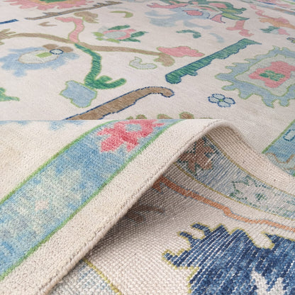 Back weaving of handwoven Oushak rug showing traditional knotting