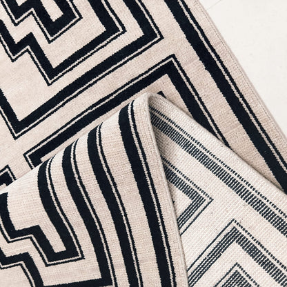 Flatwoven back detail of black and ivory handwoven wool rug
