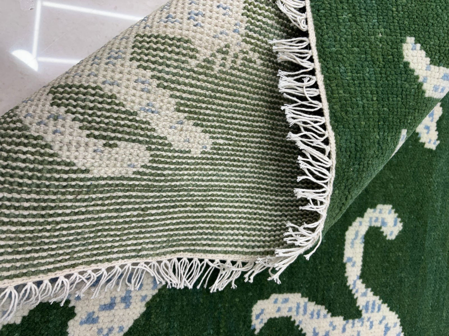 Flatwoven back of artisan handmade wool rug
