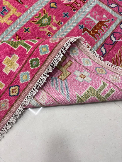 Folded handwoven wool rug showing thickness and texture