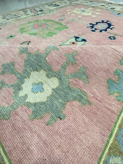 Large handmade blush pink Oushak wool area rug with ivory decorative border