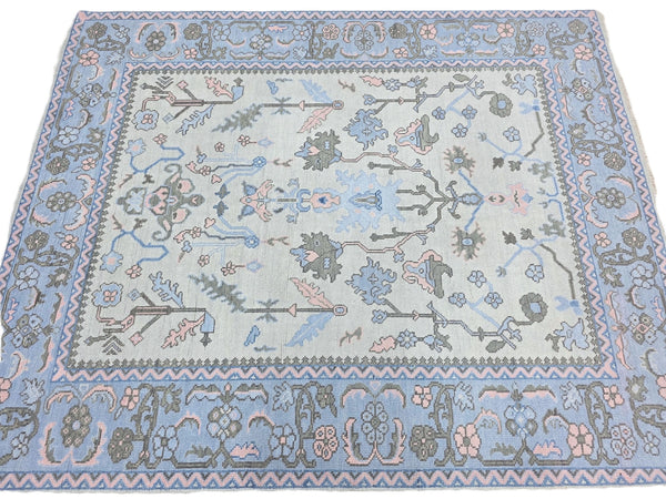 Light blue traditional floral runner rug with pink, sage green and grey botanical design