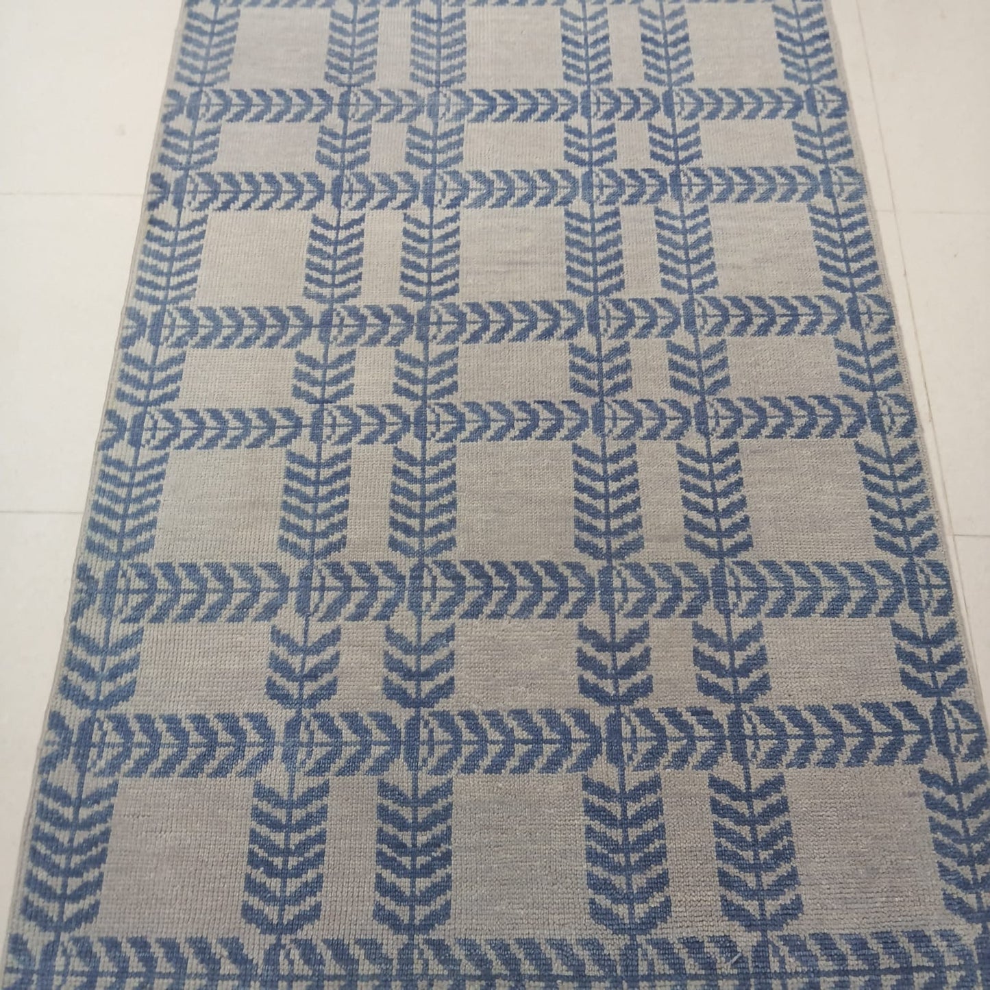 Full view of modern blue and ivory flatweave wool area rug with Scandinavian geometric design