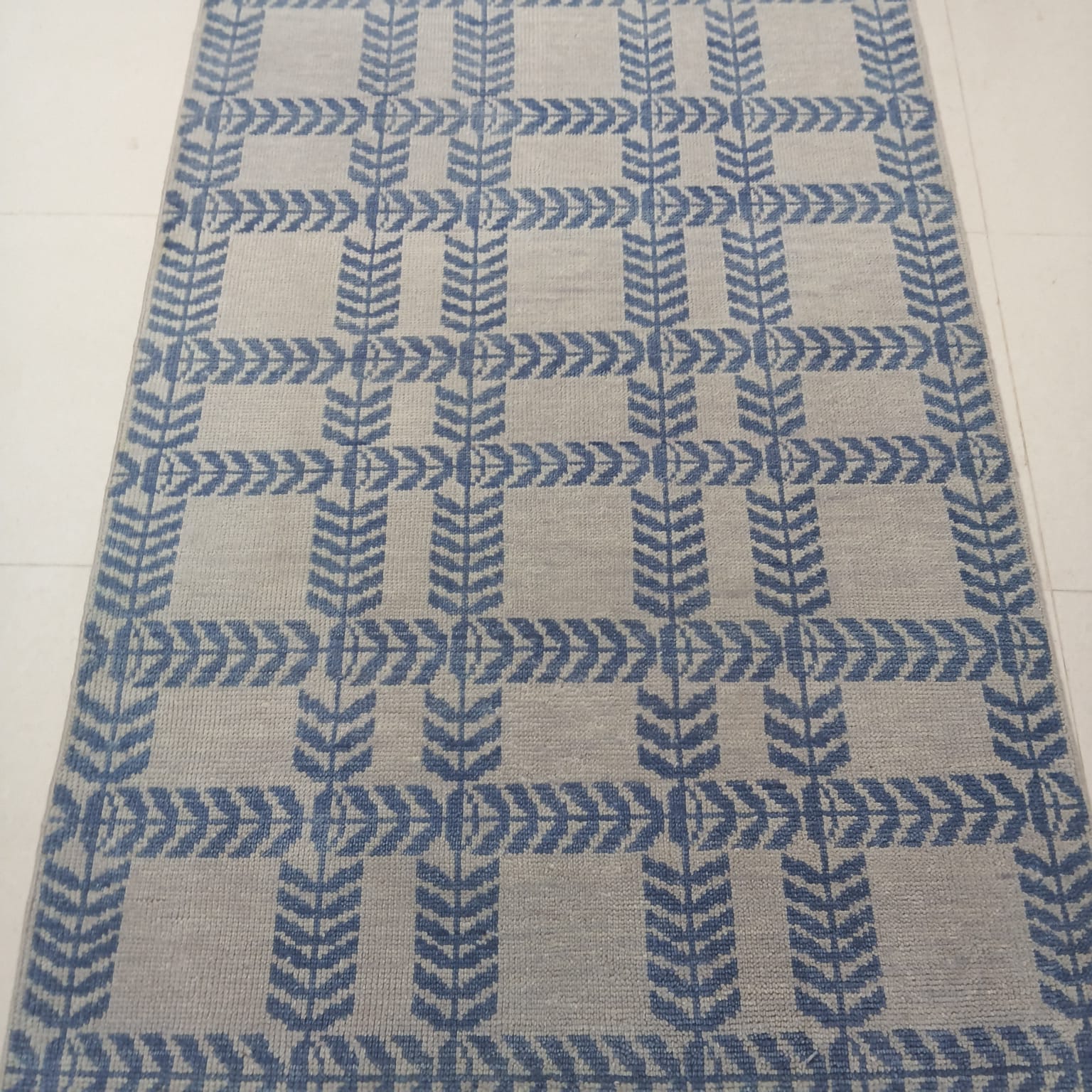 Full view of modern blue and ivory flatweave wool area rug with Scandinavian geometric design