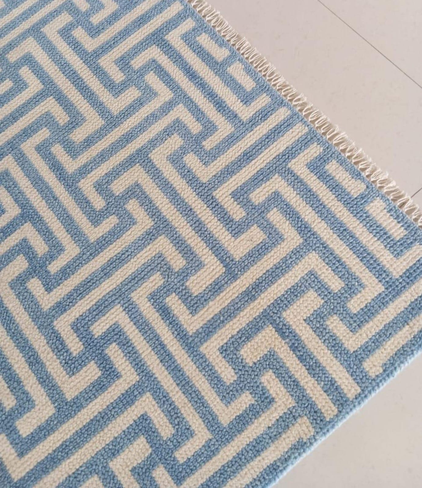 Modern handwoven geometric wool rug in blue and ivory