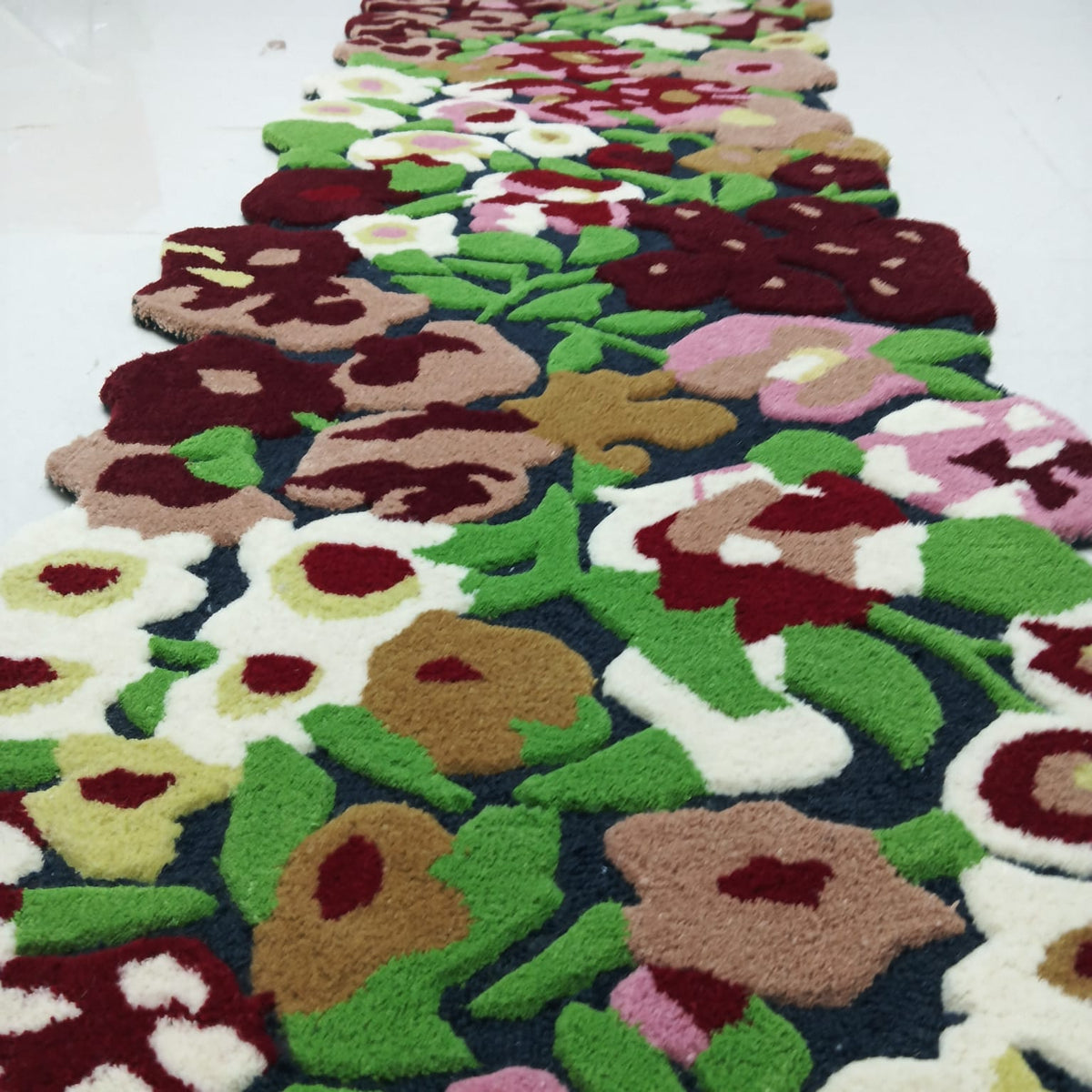 Low-angle view showing raised pile on a multicolor floral rug
