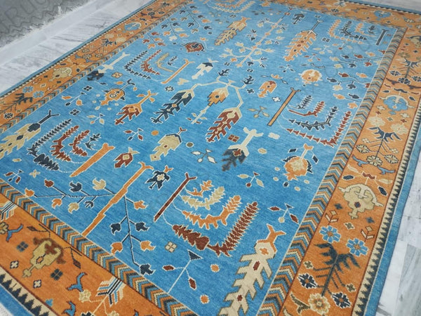 Handmade Oushak rug from Oushakaura collection featuring traditional motifs and natural wool texture