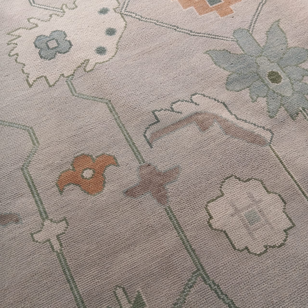 Low pile texture of handwoven Oushak wool rug