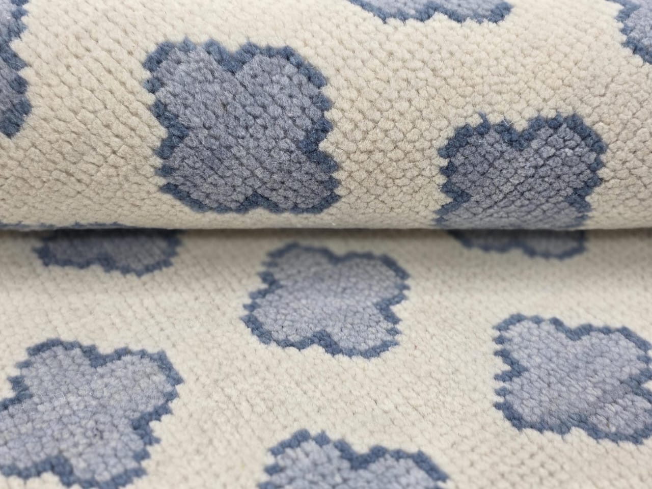 Close-up of handwoven Oushak wool rug showing flatweave texture and soft wool fibers