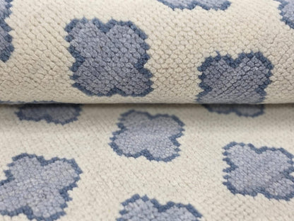 Close-up of handwoven Oushak wool rug showing flatweave texture and soft wool fibers
