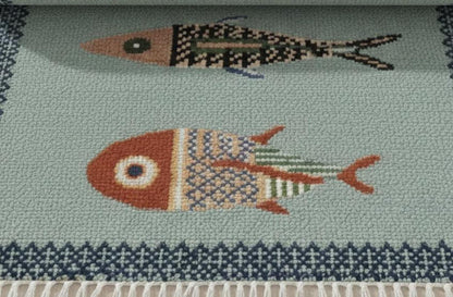 oushakaura Close-up of handmade fish motif runner rug with detailed artisan woven coastal pattern