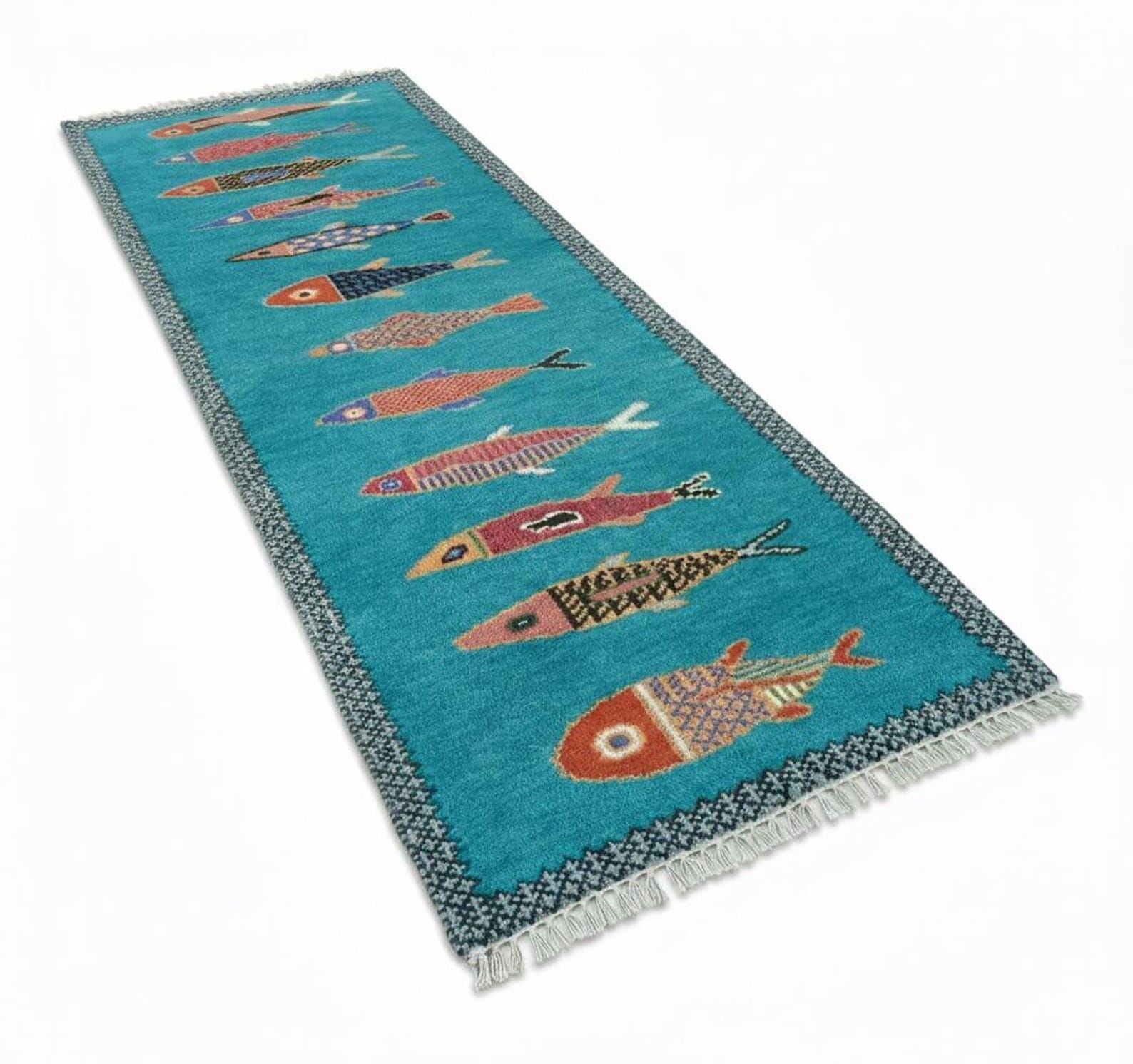 Handmade turquoise coastal fish runner rug by Oushakaura with colorful nautical fish motifs and woven texture