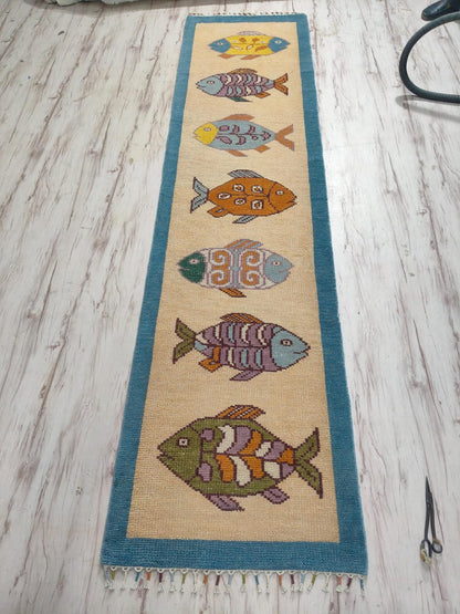 Detailed texture view of Oushakaura artisan fish runner rug for beach house and coastal interiors