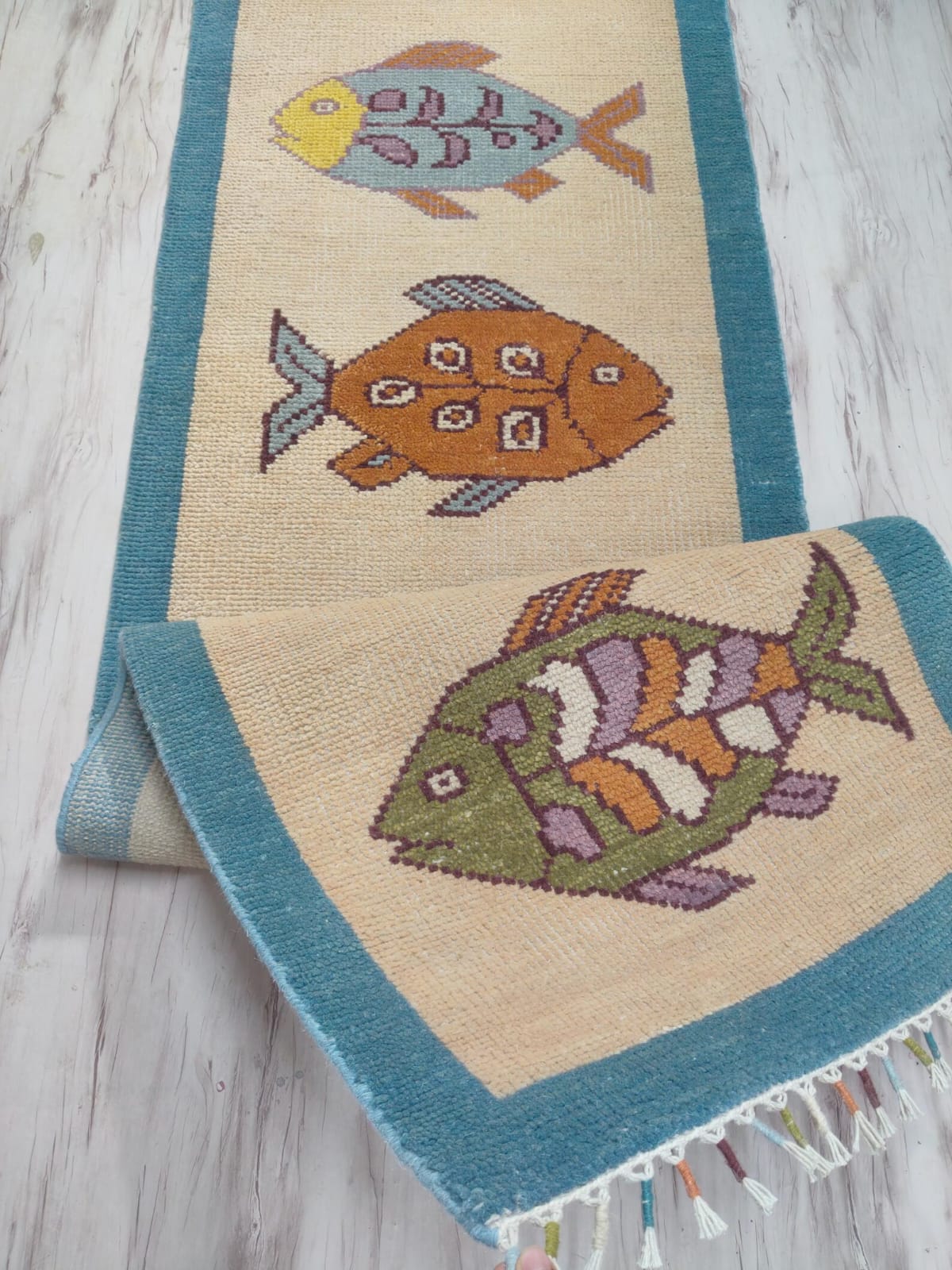 Long handmade hallway runner rug with fish motifs by Oushakaura for coastal home decor