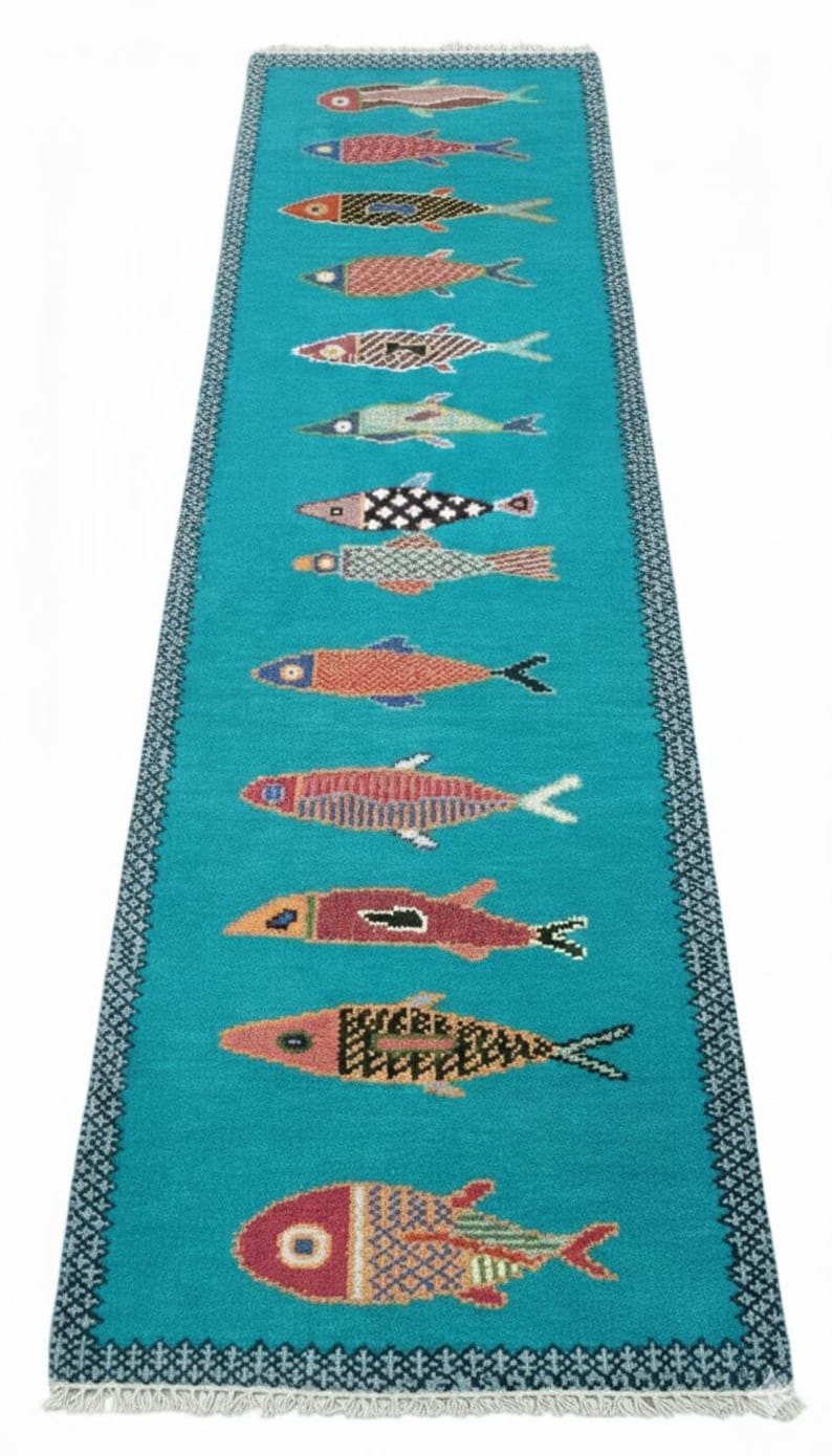 Long handmade fish hallway runner rug in turquoise blue with artisan fish patterns by Oushakaura