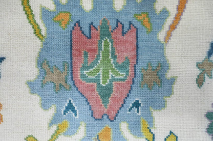 Close-up of a needlepoint design with geometric patterns and colors.