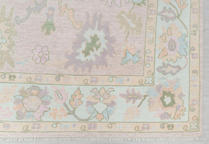 Close-up of pastel floral runner rug showing decorative border and botanical motifs