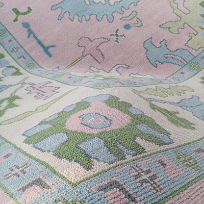 Pink Oushak Rug with Blue & Green Floral Design