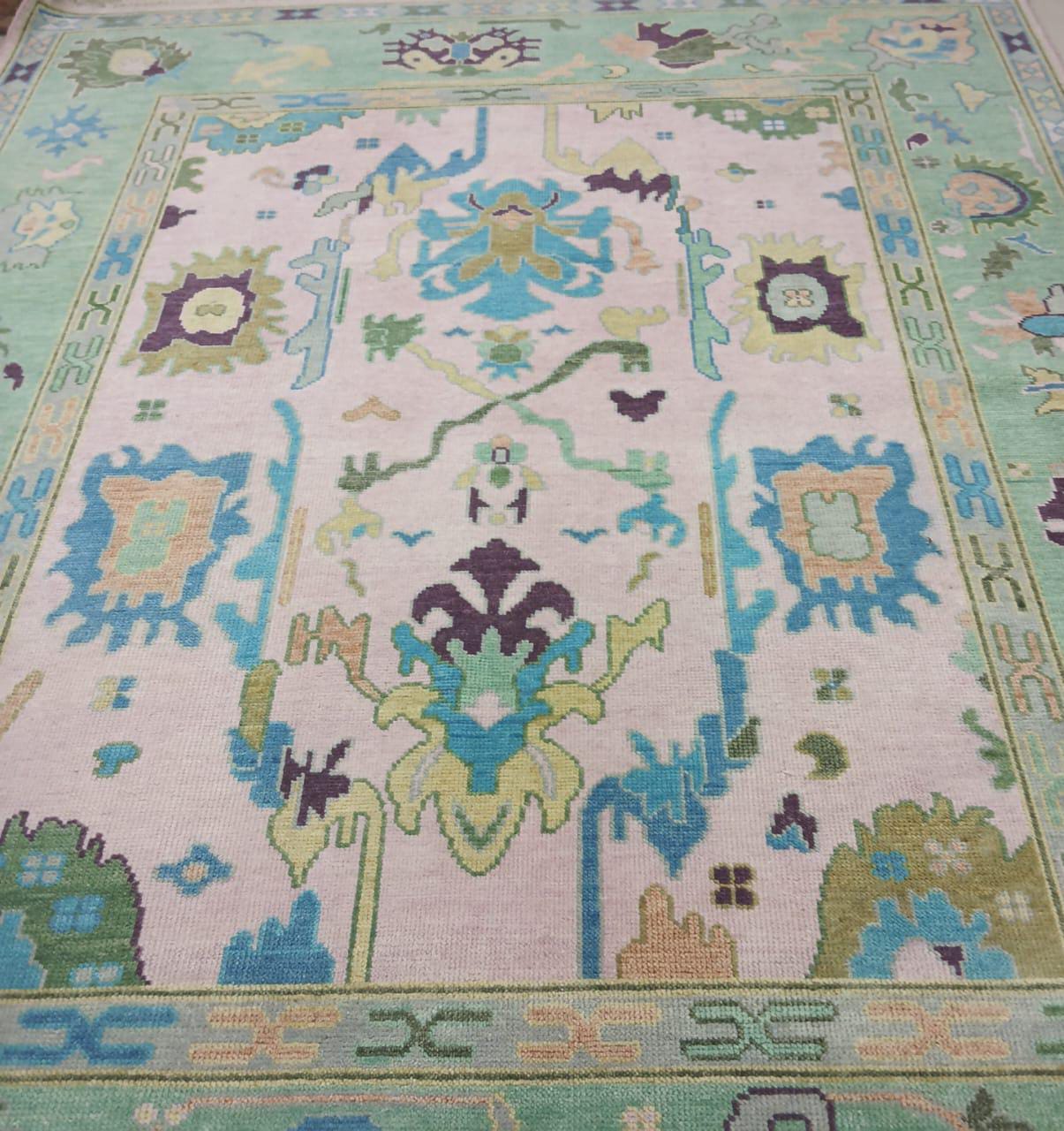 Turkish Oushak rug border with pastel green and blue detailing