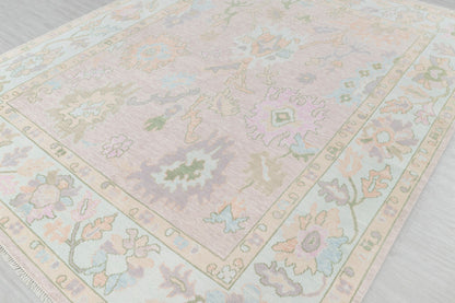 Close-up of pastel floral runner rug showing decorative border and botanical motifs